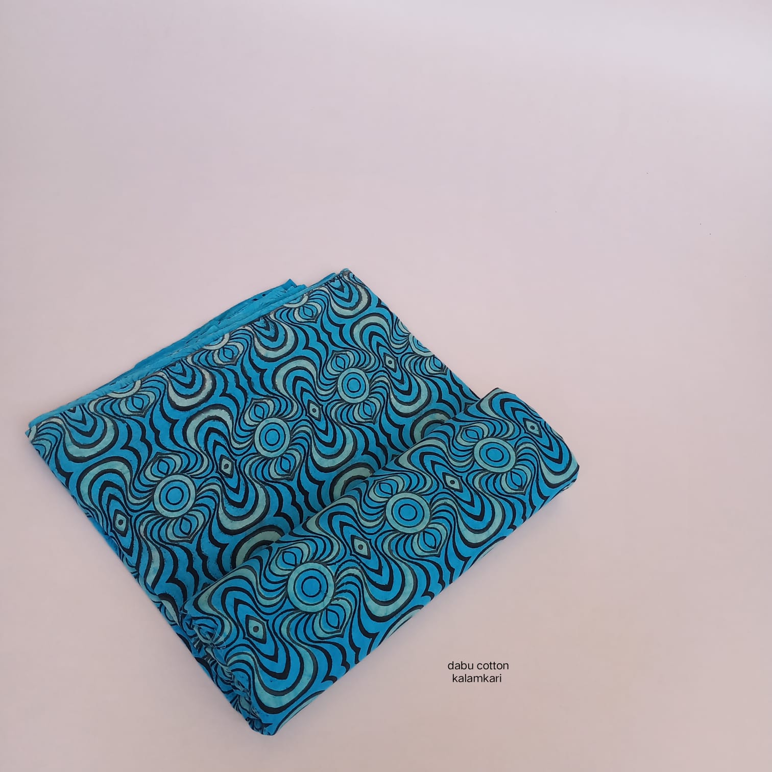 Blue abstract Dabu handblock printed pure cotton fabric, available for boutique bulk orders.