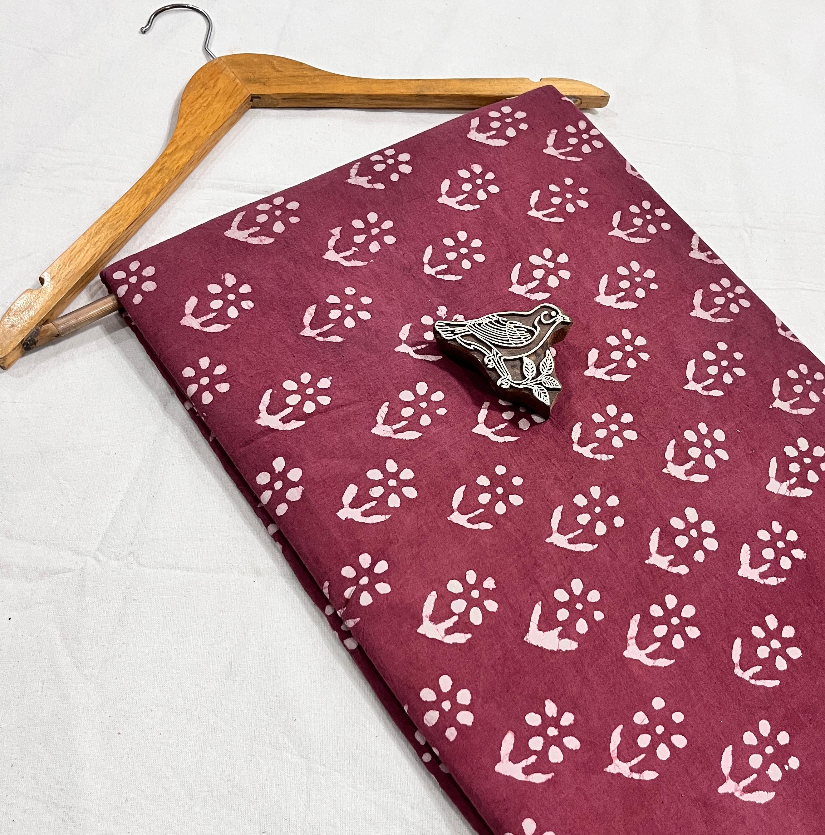Maroon natural-dyed pure cotton Dabu handblock print fabric, handcrafted for boutique wholesalers.