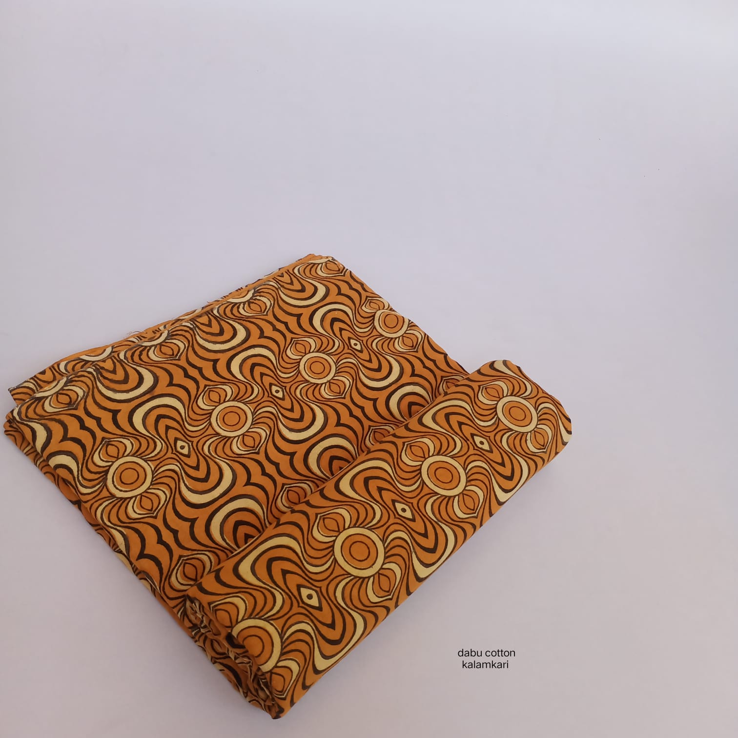 Mustard abstract Dabu cotton handblock textile, slow-crafted and supplied wholesale.