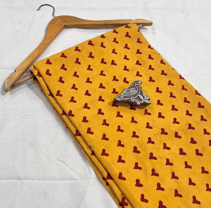 Yellow-red heart motif pure cotton Dabu handblock printed fabric, artisan textile for bulk orders.