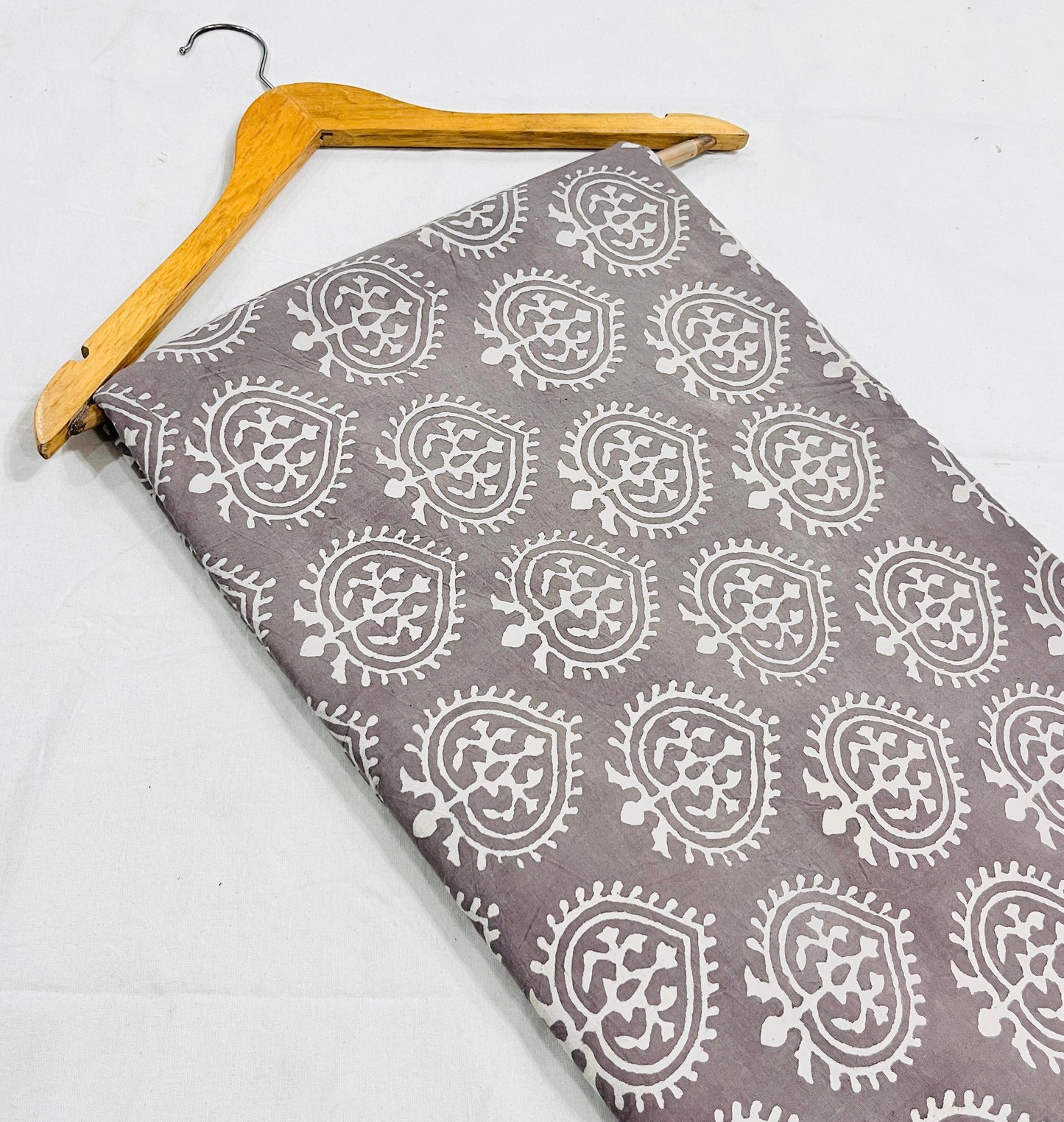 Grey leaf-pattern pure cotton Dabu handblock print, natural resist-dyed wholesale fabric.