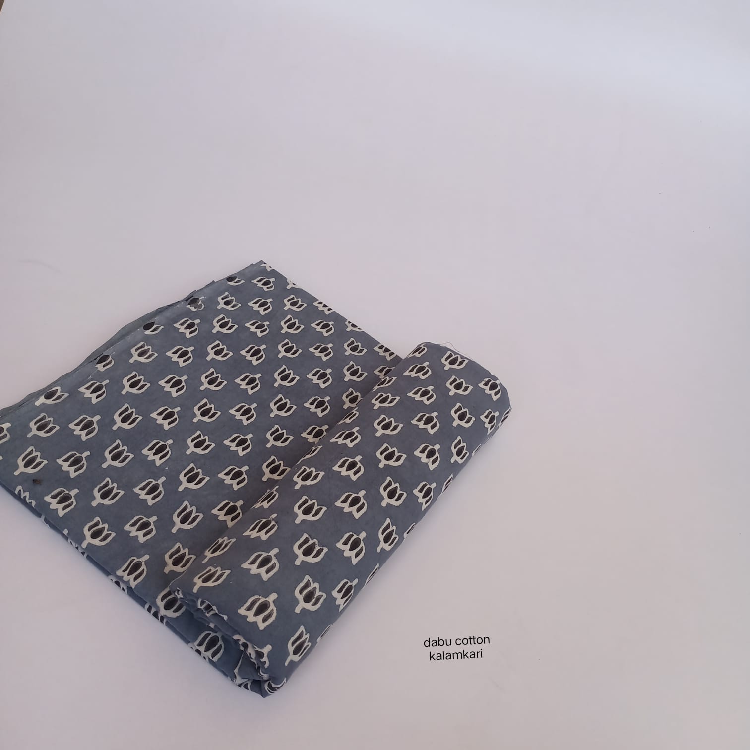 Grey lotus print Dabu handblock cotton fabric, artisan-made, wholesale for boutique owners and retailers