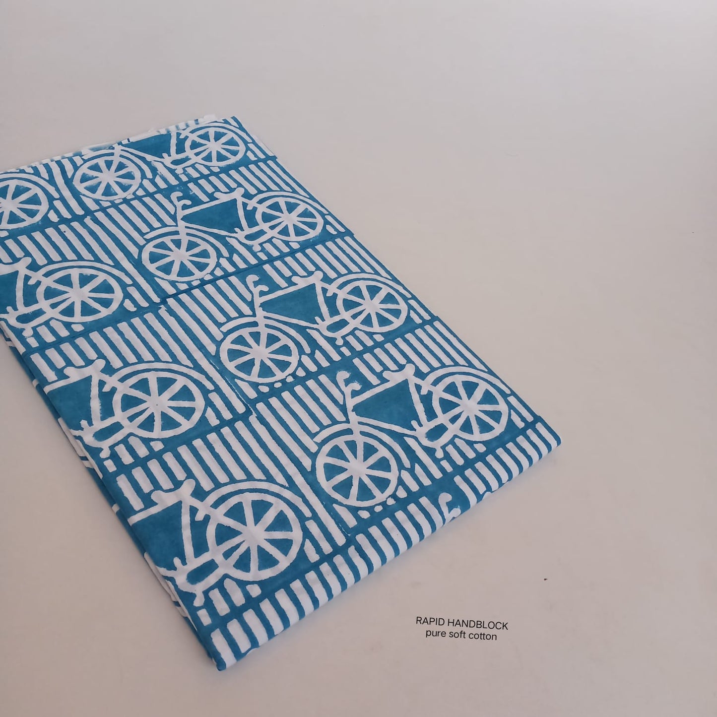 Blue cycle motif pure cotton Jaipur Sanganeri handblock fabric wholesale by Fabtexs