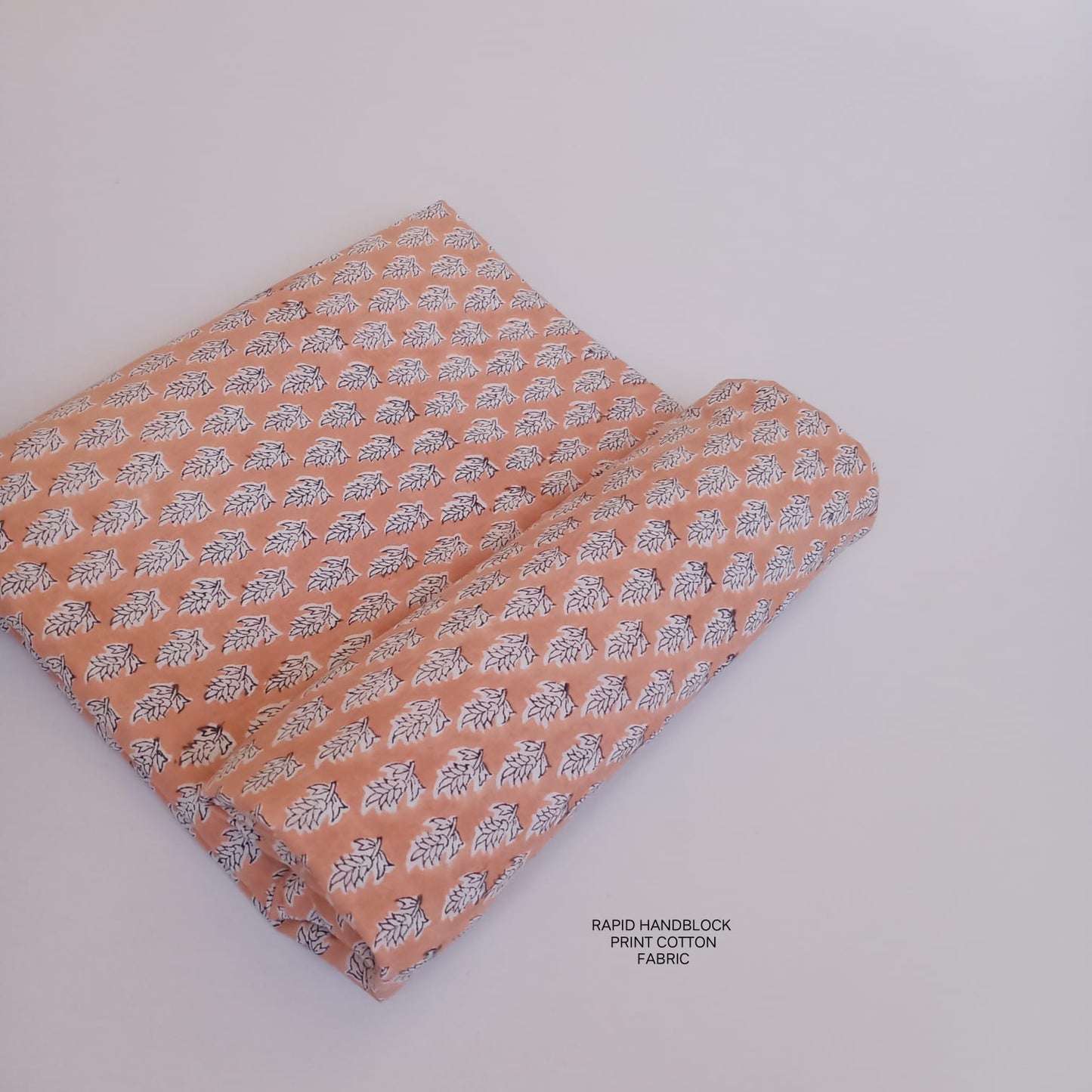 Jaipur Sanganeri handblock printed cotton fabric wholesale in peach jaal pattern