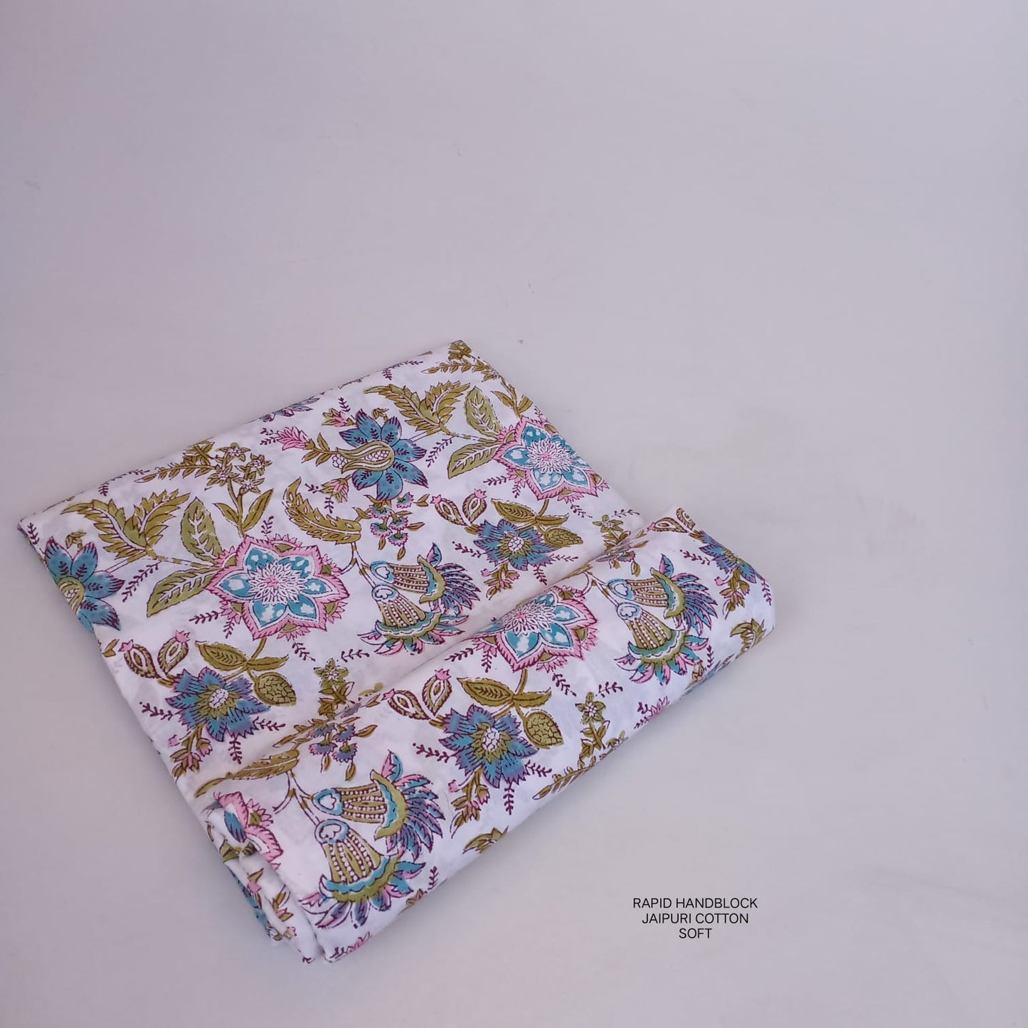 Jaipur Sanganeri handblock printed cotton fabric wholesale in white blue floral jaal pattern