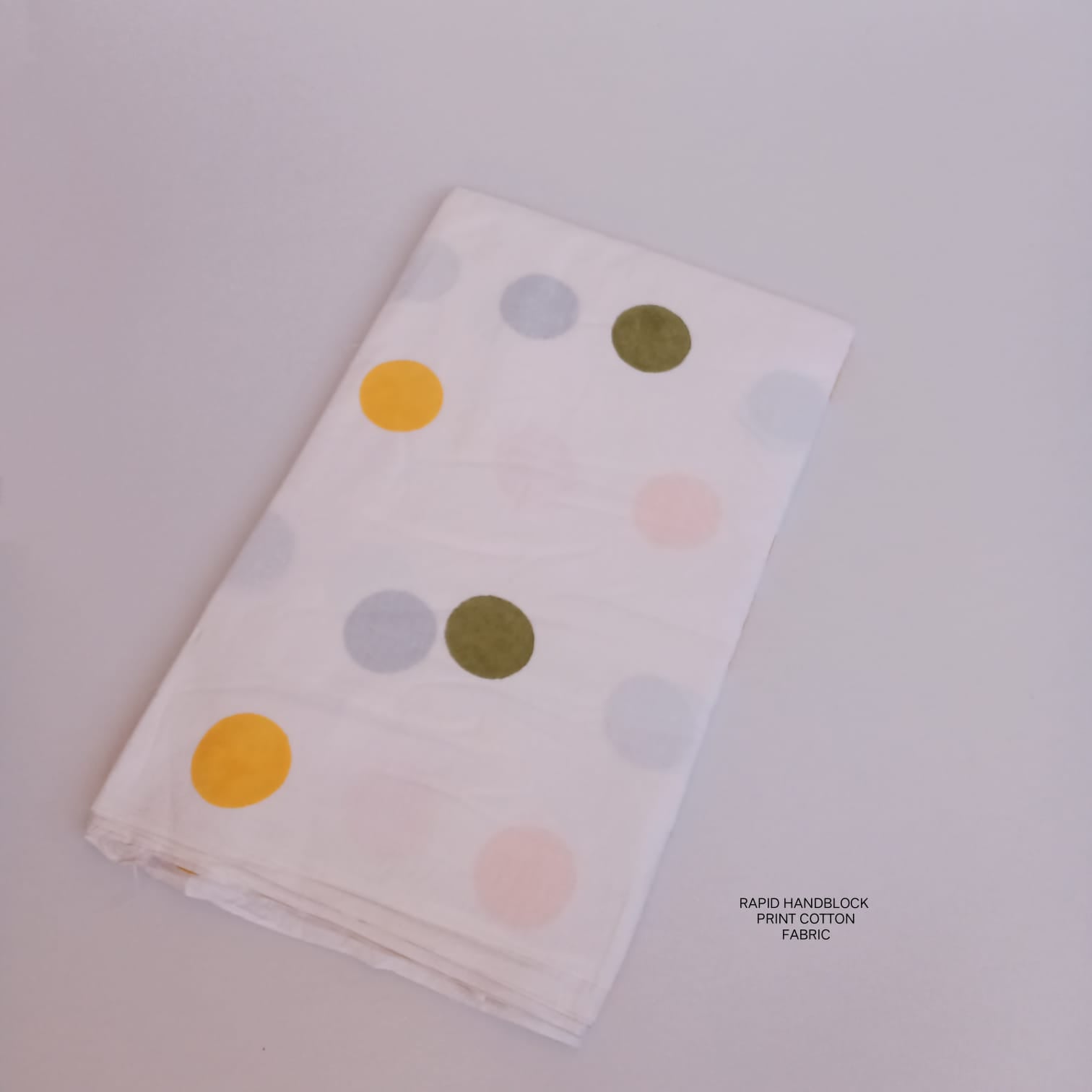 Jaipur Sanganeri handblock printed cotton fabric wholesale in white green polka dot pattern