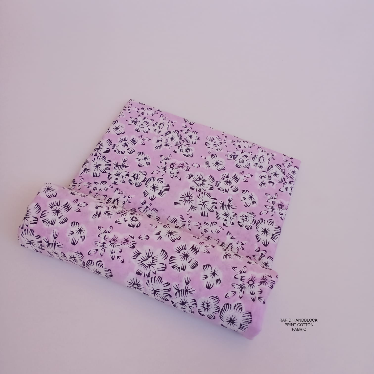 Jaipur Sanganeri handblock printed cotton fabric wholesale in white light purple floral design