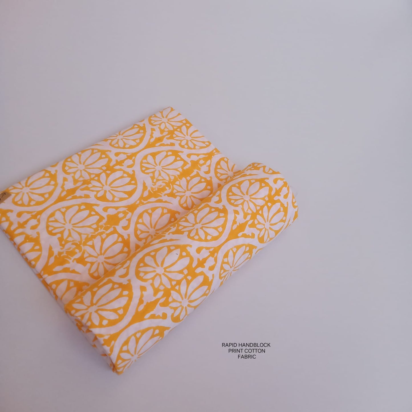 Jaipur Sanganeri handblock printed cotton fabric wholesale in white yellow floral design