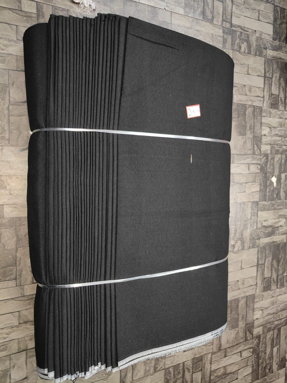 Black plain khadi cotton textile, machine-woven for wholesale fashion and uniform supply