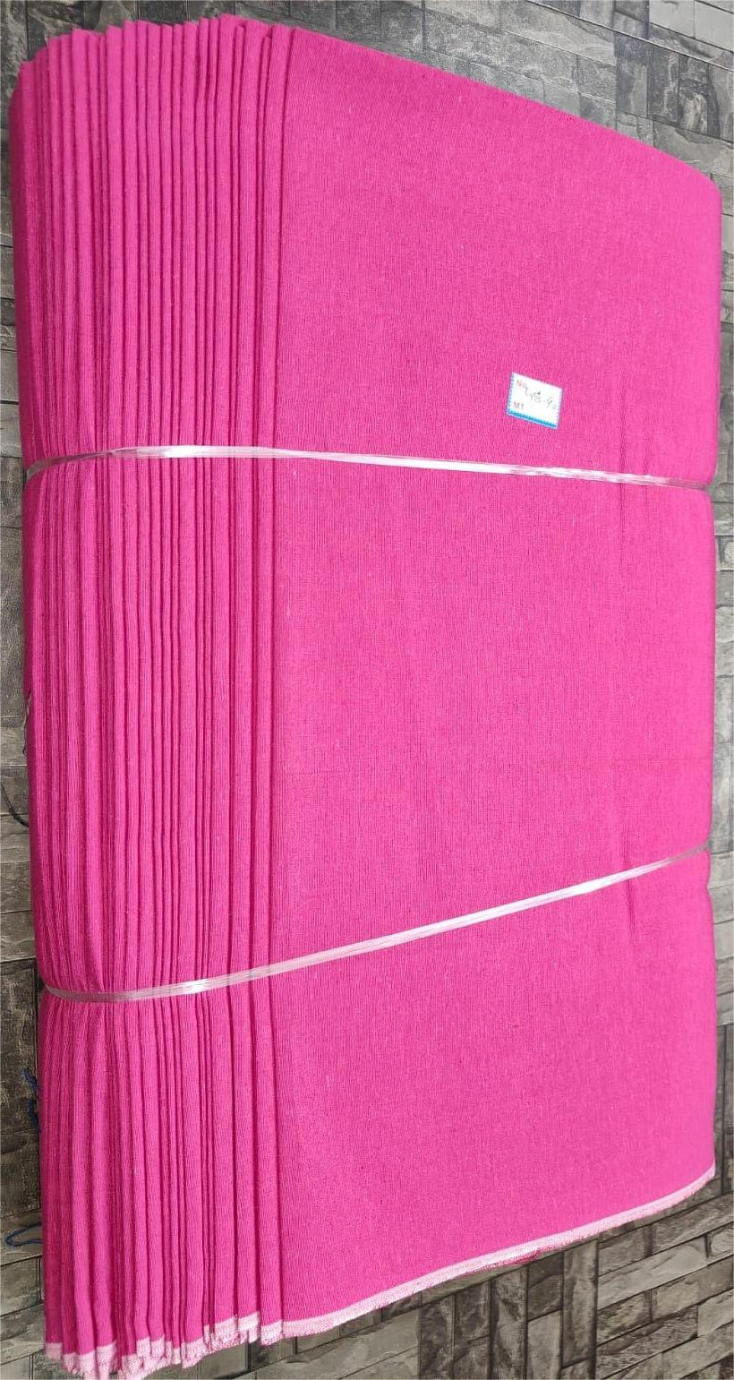 Fuchsia pink plain khadi cotton fabric, machine-woven for wholesale textile sourcing