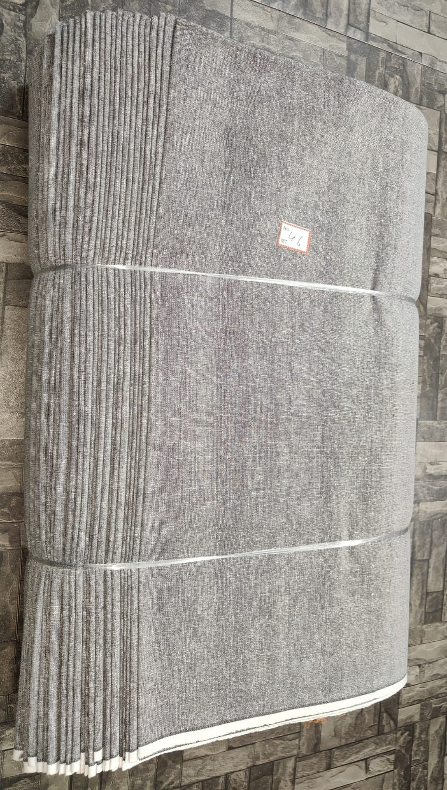 Light grey plain khadi cotton fabric, machine-woven for B2B garment production