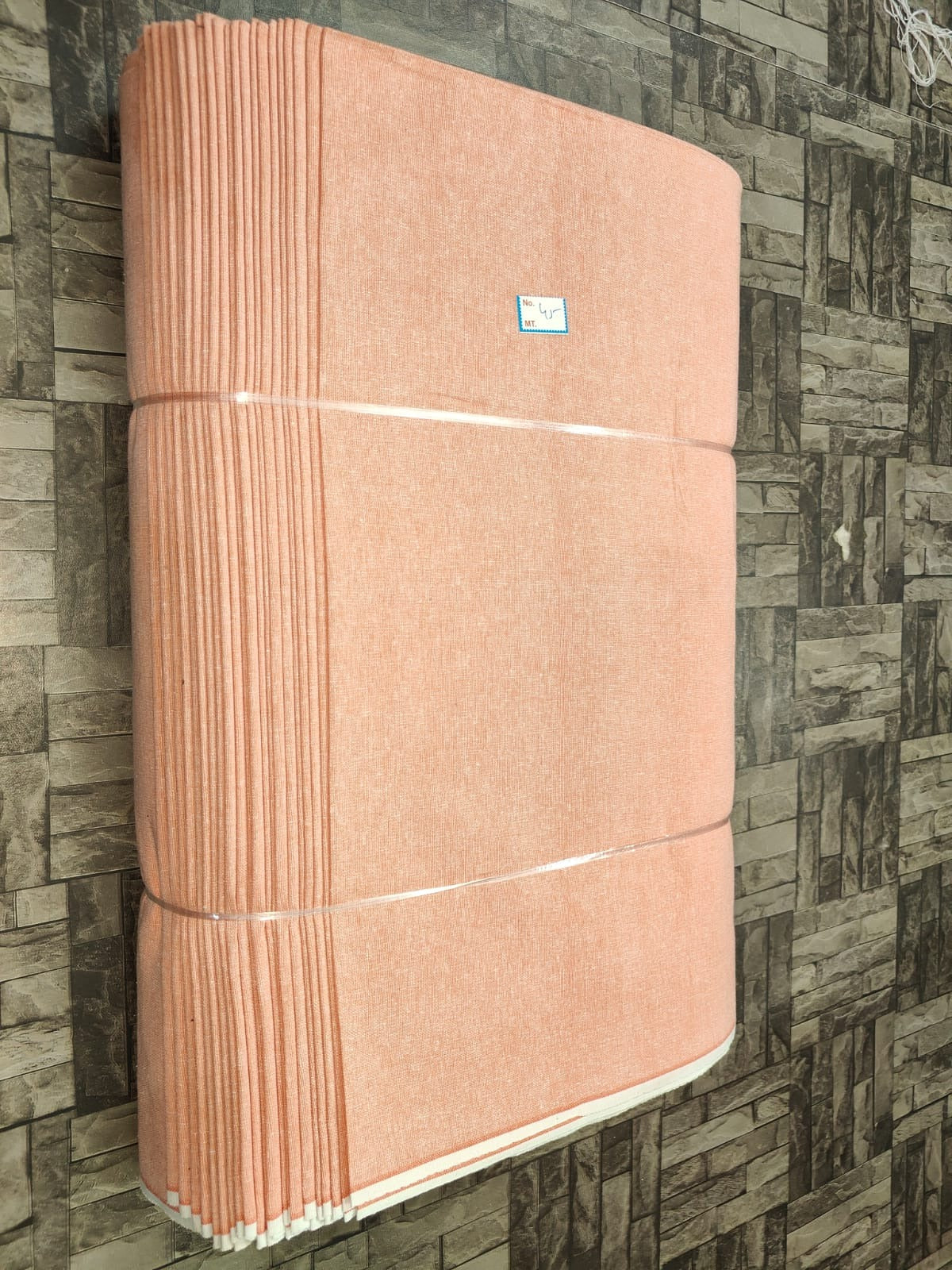 Light peach plain khadi fabric, pure cotton machine-woven for bulk textile orders