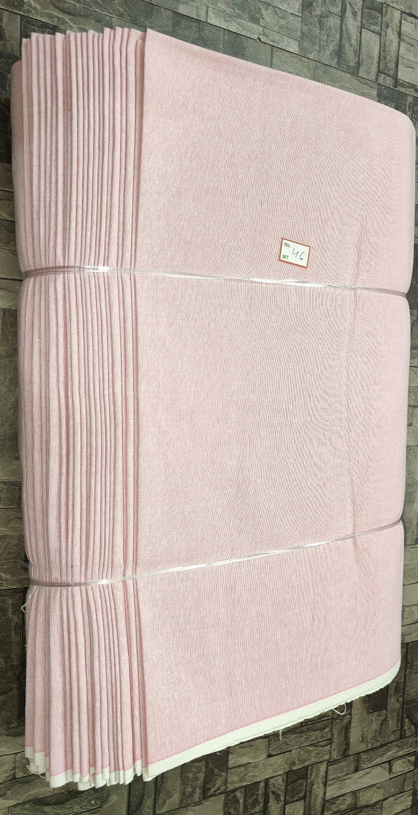 Light pink plain khadi fabric in pure cotton, machine-woven for boutique sourcing