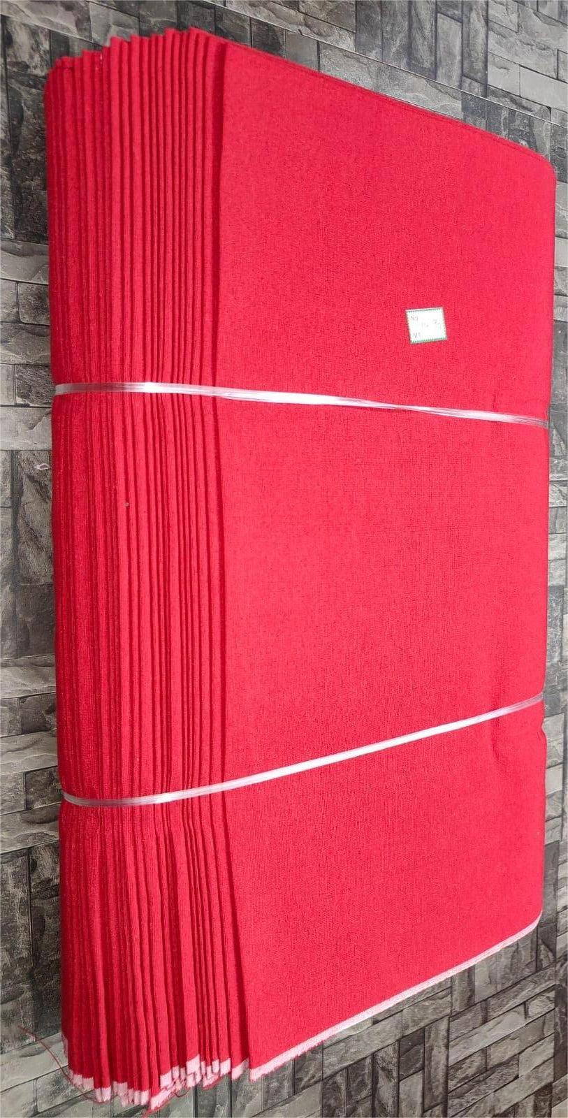Red plain khadi cotton textile, machine-woven for wholesale apparel manufacturing