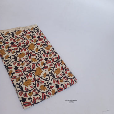 Mustard yellow Bagru handblock printed pure cotton fabric featuring lotus floral motifs, handcrafted for sustainable design use.