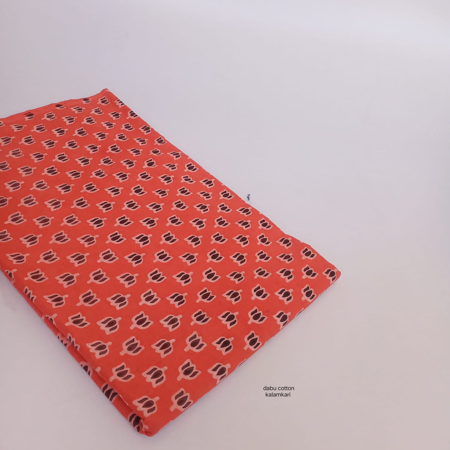 Orange lotus Dabu handblock cotton fabric, artisan-crafted, wholesale for boutique owners and retailers
