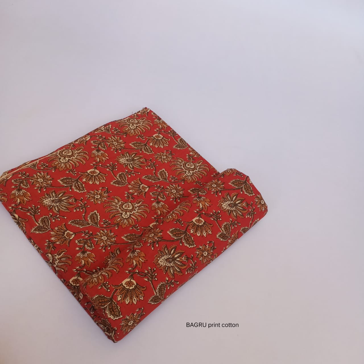 Red jaal Bagru handblock printed pure cotton fabric, naturally dyed and artisan-made for wholesale fabric buyers.