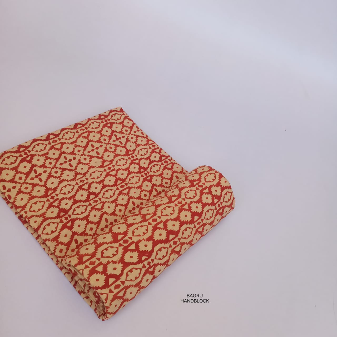Rust geometric Bagru handblock printed fabric in pure cotton, handcrafted and suitable for slow fashion labels